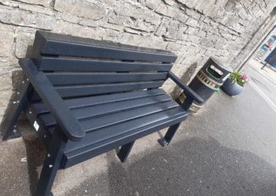 NGP next generation plastics plastic bench against wall in city