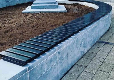 Plastic bench on street concrete base