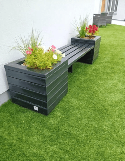 Recycled Plastic Planters Next Generation Plastics NGP Bench with flower blooming