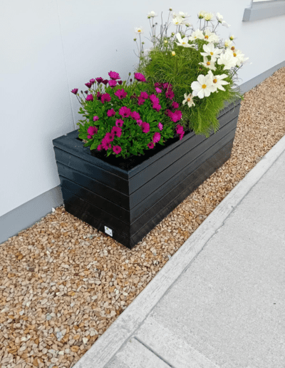 Recycled Plastic Planters Next Generation Plastics NGP rectangular style with pink and white flowers