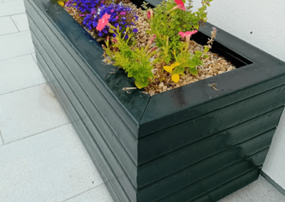 Recycled Plastic Planters Next Generation Plastics NGP with summer flowers blooming in Ireland